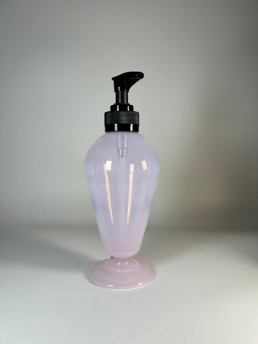 transparent pink soap dispenser